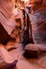 Canyon X, a spectacular slot canyon near Page, Arizona.  Slot canyons are formed when water and wind erode a cut through a (usually sandstone) mesa, producing a very narrow passage that may be as slim as a few feet and a hundred feet or more in height. USA. Image #36008