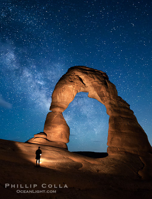 Delicate Arch and Milky Way, lit by quarter moon, hiker's flashlight and the fading blue sky one hour after sunset. Arches National Park, Utah Delicate Arch and Milky Way, lit by quarter moon, hiker's flashlight and the fading blue sky one hour after sunset. Arches National Park, Utah