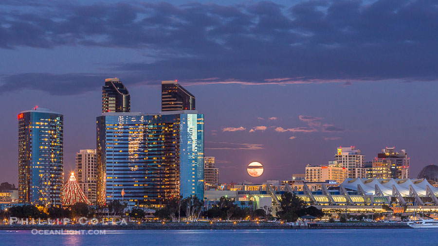 Full moon rising over San Diego city skyline, sunset, storm clouds, viewed from Coronado Island Full moon rising over San Diego city skyline, sunset, storm clouds, viewed from Coronado Island