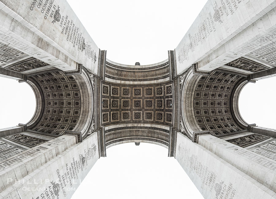 Arc de Triomphe. The Arc de Triomphe (Arc de Triomphe de l'Etoile) is one of the most famous monuments in Paris. It stands in the centre of the Place Charles de Gaulle (originally named Place de l'Etoile), at the western end of the Champs-Elysees. The Arc de Triomphe (in English: "Triumphal Arch") honors those who fought and died for France in the French Revolutionary and the Napoleonic Wars, with the names of all French victories and generals inscribed on its inner and outer surfaces. Beneath its vault lies the Tomb of the Unknown Soldier from World War I. The monument was designed by Jean Chalgrin in 1806, and its iconographic program pitted heroically nude French youths against bearded Germanic warriors in chain mail. It set the tone for public monuments, with triumphant patriotic messages. The monument stands 50 metres (164 ft) in height, 45 m (148 ft) wide and 22 m (72 ft) deep Arc de Triomphe. The Arc de Triomphe (Arc de Triomphe de l'Etoile) is one of the most famous monuments in Paris. It stands in the centre of the Place Charles de Gaulle (originally named Place de l'Etoile), at the western end of the Champs-Elysees. The Arc de Triomphe (in English: "Triumphal Arch") honors those who fought and died for France in the French Revolutionary and the Napoleonic Wars, with the names of all French victories and generals inscribed on its inner and outer surfaces. Beneath its vault lies the Tomb of the Unknown Soldier from World War I. The monument was designed by Jean Chalgrin in 1806, and its iconographic program pitted heroically nude French youths against bearded Germanic warriors in chain mail. It set the tone for public monuments, with triumphant patriotic messages. The monument stands 50 metres (164 ft) in height, 45 m (148 ft) wide and 22 m (72 ft) deep