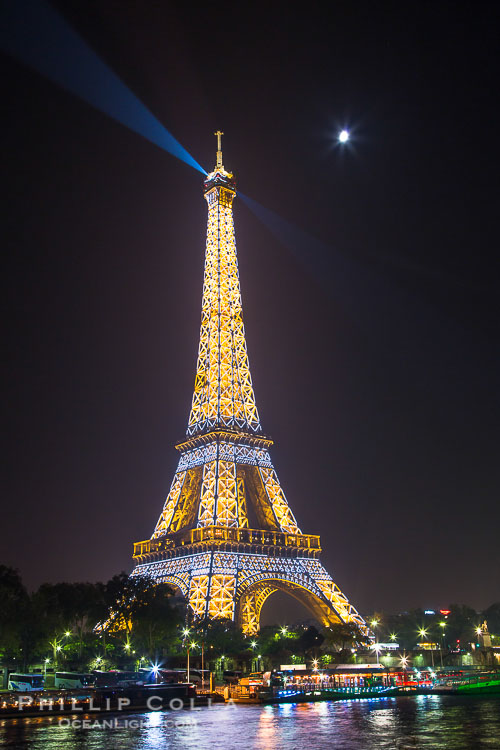 River Seine, Full Moon and Eiffel Tower at night, Paris. La Tour Eiffel. The Eiffel Tower is an iron lattice tower located on the Champ de Mars in Paris, named after the engineer Gustave Eiffel, who designed the tower in 1889 as the entrance arch to the 1889 World's Fair. The Eiffel tower is the tallest structure in Paris and the most-visited paid monument in the world River Seine, Full Moon and Eiffel Tower at night, Paris. La Tour Eiffel. The Eiffel Tower is an iron lattice tower located on the Champ de Mars in Paris, named after the engineer Gustave Eiffel, who designed the tower in 1889 as the entrance arch to the 1889 World's Fair. The Eiffel tower is the tallest structure in Paris and the most-visited paid monument in the world
