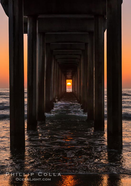 Scripps Pier Sunset Solar Alignment, the setting sun is framed perfectly within the pilings of Scripps Institution of Oceanography research pier, a rare event.