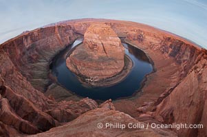 Horseshoe Bend.  The Colorado River makes a 180-degree turn at Horseshoe Bend.  Here the river has eroded the Navaho sandstone for eons, digging a canyon 1100-feet deep, Navajo Tribal Lands, Page, Arizona