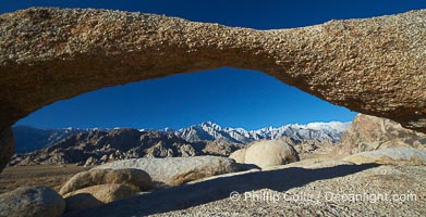 Lathe Arch framing Mt. Whitney, Lone Pine Peak and the Sierra Nevada mountains.  Lathe Arch is found in the Alabama Hills Recreational Area