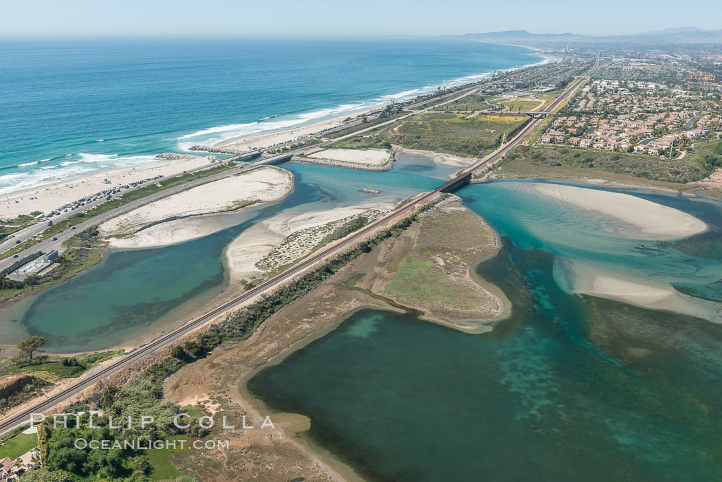 Aerial photo of Batiquitos Lagoon, Carlsbad. The Batiquitos Lagoon is a coastal wetland in southern Carlsbad, California. Part of the lagoon is designated as the Batiquitos Lagoon State Marine Conservation Area, run by the California Department of Fish and Game as a nature reserve. Callifornia, USA, natural history stock photograph, photo id 30558
