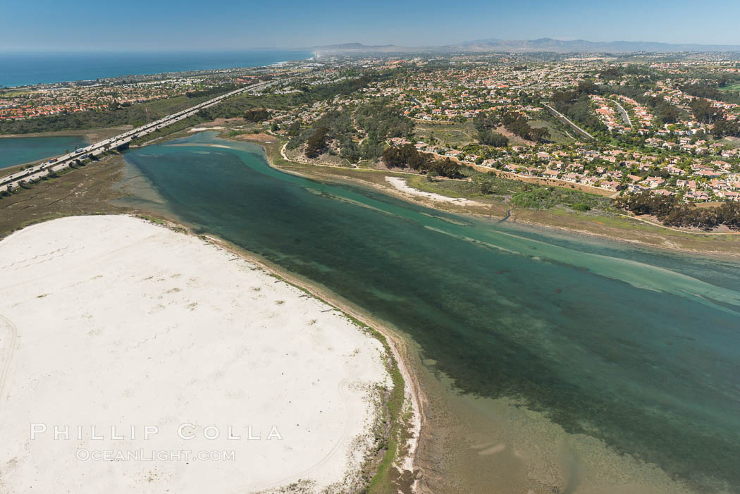 Aerial photo of Batiquitos Lagoon, Carlsbad. The Batiquitos Lagoon is a coastal wetland in southern Carlsbad, California. Part of the lagoon is designated as the Batiquitos Lagoon State Marine Conservation Area, run by the California Department of Fish and Game as a nature reserve. Callifornia, USA, natural history stock photograph, photo id 30560