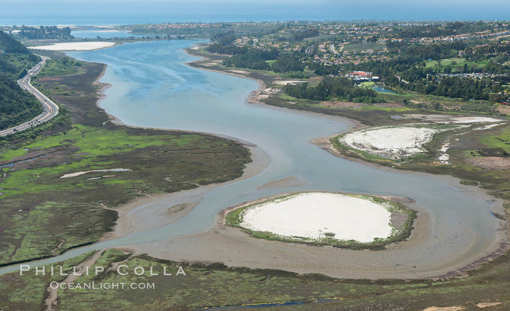 Aerial photo of Batiquitos Lagoon, Carlsbad. The Batiquitos Lagoon is a coastal wetland in southern Carlsbad, California. Part of the lagoon is designated as the Batiquitos Lagoon State Marine Conservation Area, run by the California Department of Fish and Game as a nature reserve