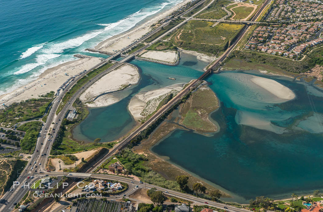 Aerial photo of Batiquitos Lagoon, Carlsbad. The Batiquitos Lagoon is a coastal wetland in southern Carlsbad, California. Part of the lagoon is designated as the Batiquitos Lagoon State Marine Conservation Area, run by the California Department of Fish and Game as a nature reserve. Callifornia, USA, natural history stock photograph, photo id 30571