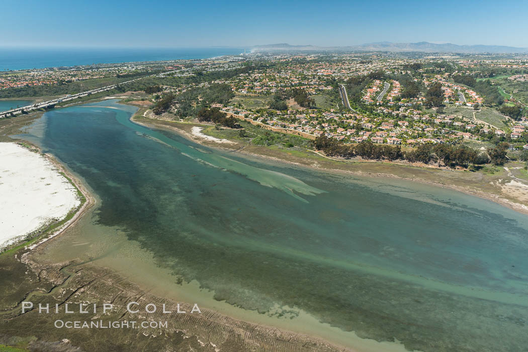 Aerial photo of Batiquitos Lagoon, Carlsbad. The Batiquitos Lagoon is a coastal wetland in southern Carlsbad, California. Part of the lagoon is designated as the Batiquitos Lagoon State Marine Conservation Area, run by the California Department of Fish and Game as a nature reserve. Callifornia, USA, natural history stock photograph, photo id 30561