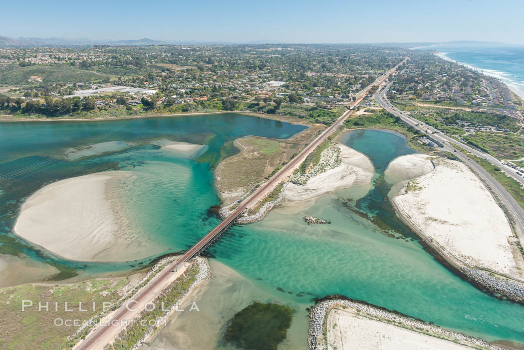 Aerial photo of Batiquitos Lagoon, Carlsbad. The Batiquitos Lagoon is a coastal wetland in southern Carlsbad, California. Part of the lagoon is designated as the Batiquitos Lagoon State Marine Conservation Area, run by the California Department of Fish and Game as a nature reserve. Callifornia, USA, natural history stock photograph, photo id 30569