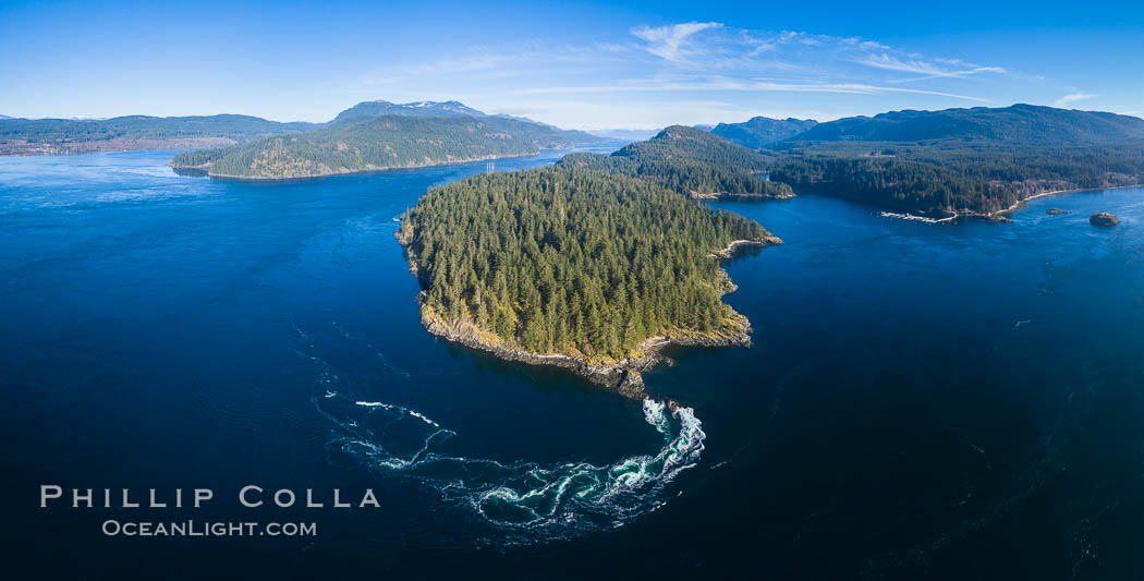 Seymour Narrows with strong tidal currents.  Between Vancouver Island and Quadra Island, Seymour Narrows is about 750 meters wide and has currents reaching 15 knots.  Aerial photo