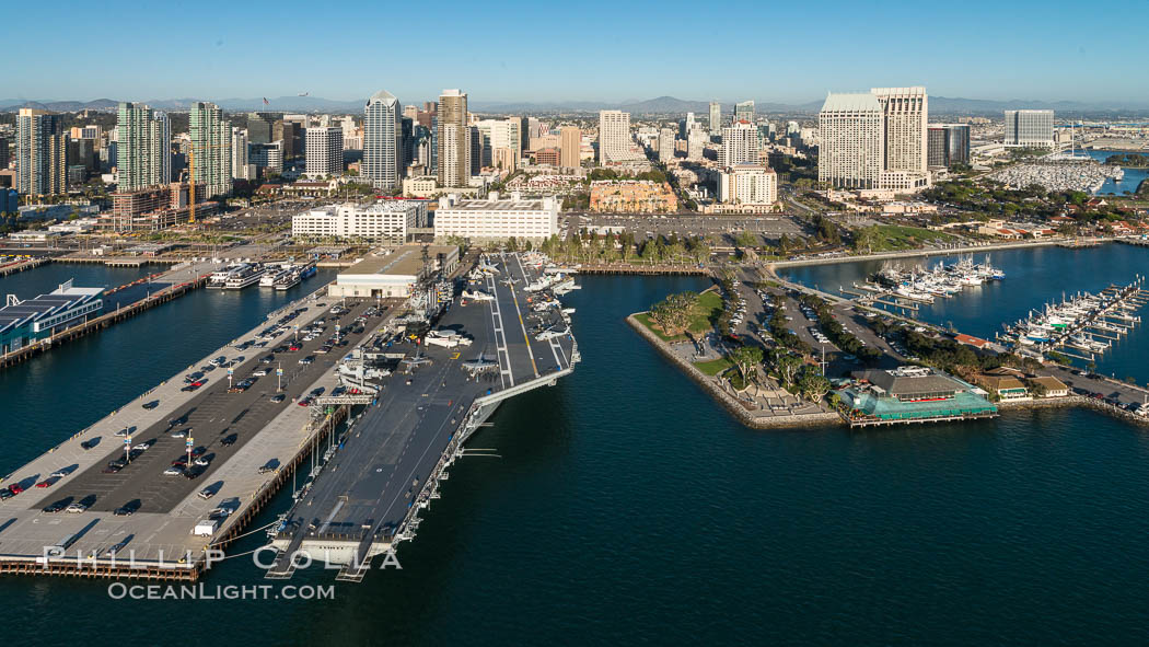 Downtown San Diego and USS Midway. The USS Midway was a US Navy aircraft carrier, launched in 1945 and active through the Vietnam War and Operation Desert Storm, as of 2008 a museum along the downtown waterfront in San Diego., natural history stock photograph, photo id 30764