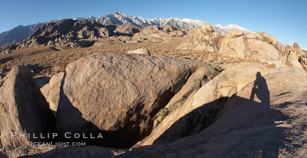 The Alabama Hills, with characteristic curious eroded rock formations formed of ancient granite and metamorphosed rock, next to the Sierra Nevada mountains and the town of Lone Pine. Alabama Hills Recreational Area, California, USA, natural history stock photograph, photo id 21757