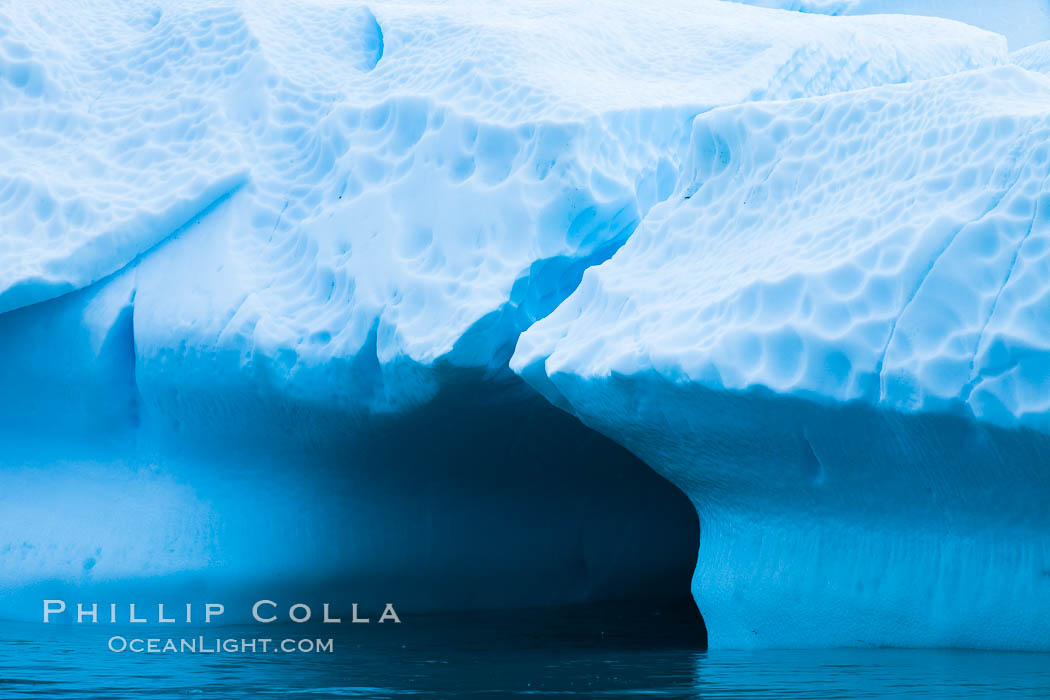 Antarctic icebergs, sculpted by ocean tides into fantastic shapes. Cierva Cove, Antarctic Peninsula, Antarctica, natural history stock photograph, photo id 25587