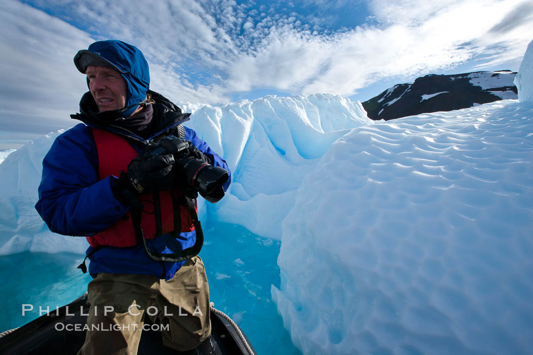 Photographer Patrick Endres works alongside an iceberg near Paulet Island