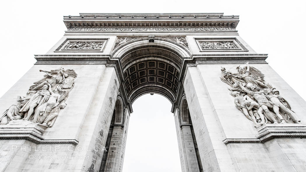 Arc de Triomphe. The Arc de Triomphe (Arc de Triomphe de l'Etoile) is one of the most famous monuments in Paris. It stands in the centre of the Place Charles de Gaulle (originally named Place de l'Etoile), at the western end of the Champs-Elysees. The Arc de Triomphe (in English: "Triumphal Arch") honors those who fought and died for France in the French Revolutionary and the Napoleonic Wars, with the names of all French victories and generals inscribed on its inner and outer surfaces. Beneath its vault lies the Tomb of the Unknown Soldier from World War I. The monument was designed by Jean Chalgrin in 1806, and its iconographic program pitted heroically nude French youths against bearded Germanic warriors in chain mail. It set the tone for public monuments, with triumphant patriotic messages. The monument stands 50 metres (164 ft) in height, 45 m (148 ft) wide and 22 m (72 ft) deep
