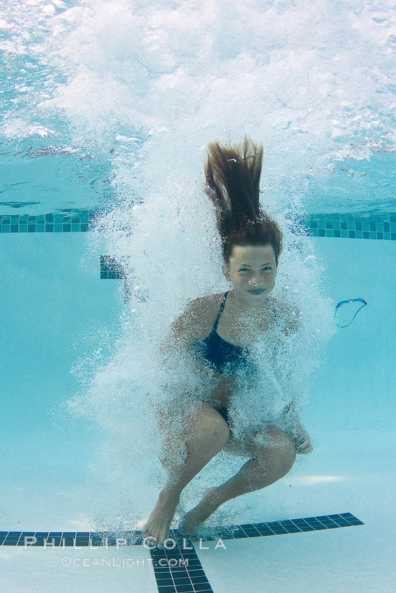 Athletic young girl underwater, performing isometric exercises., natural history stock photograph, photo id 27056