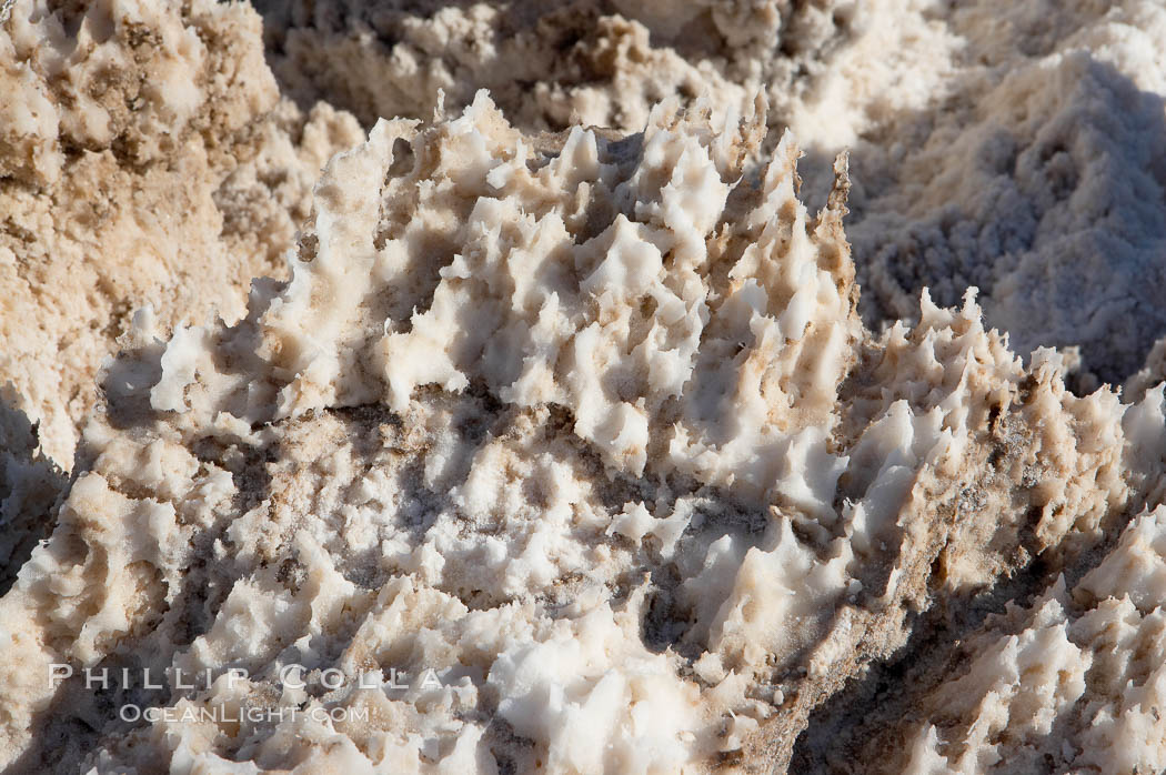 Devils Golf Course, California. Evaporated salt has formed into gnarled, complex crystalline shapes in on the salt pan of Death Valley National Park, one of the largest salt pans in the world. The shapes are constantly evolving as occasional floods submerge the salt concretions before receding and depositing more salt