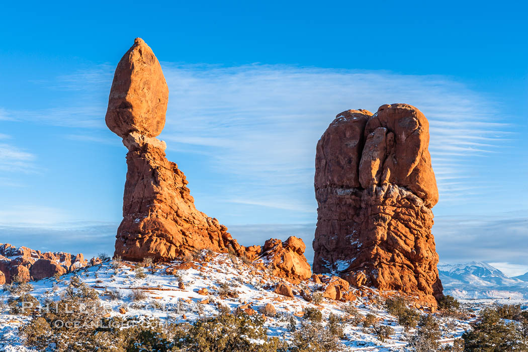 Balanced Rock, a narrow sandstone tower, appears poised to topple.  Sunset, winter. Arches National Park, Utah, USA, natural history stock photograph, photo id 18157