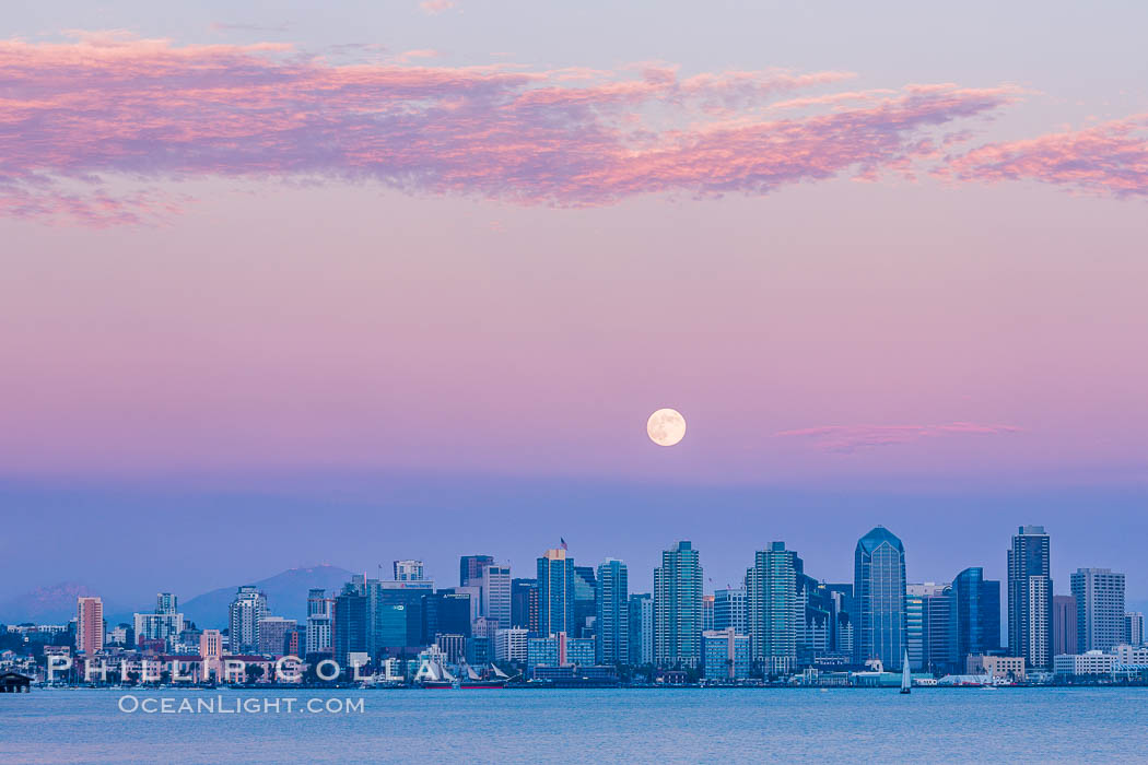 Blue Moon at Sunset over San Diego City Skyline. The third full moon in a season, this rare "blue moon" rises over San Diego just after sundown