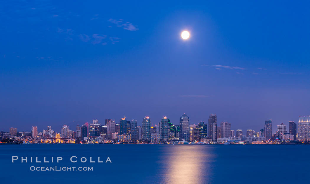 Blue Moon at Sunset over San Diego City Skyline. The third full moon in a season, this rare "blue moon" rises over San Diego just after sundown