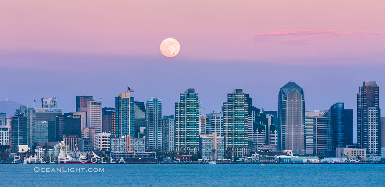 Blue Moon, Full Moon at Sunset over San Diego City Skyline, approaching jet with headlights appearing in front of the moon