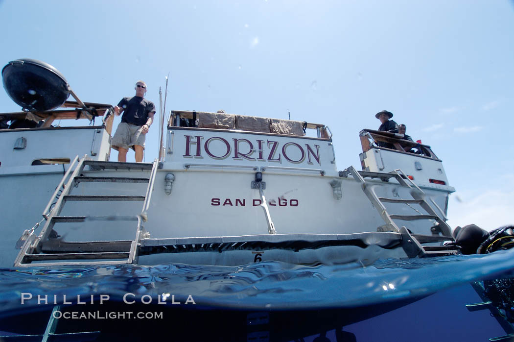 Crew of the dive boat Horizon wait at the stern to help divers out of the water. Guadalupe Island (Isla Guadalupe), Baja California, Mexico, natural history stock photograph, photo id 09723