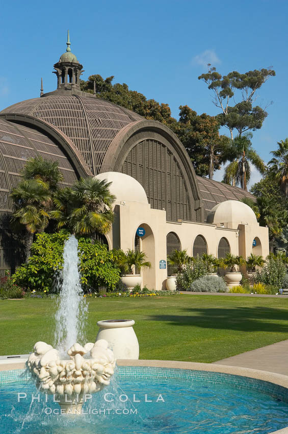 The Botanical Building in Balboa Park, San Diego. The Botanical Building, at 250 feet long by 75 feet wide and 60 feet tall, was the largest wood lath structure in the world when it was built in 1915 for the Panama-California Exposition. The Botanical Building, located on the Prado, west of the Museum of Art, contains about 2,100 permanent tropical plants along with changing seasonal flowers. The Lily Pond, just south of the Botanical Building, is an eloquent example of the use of reflecting pools to enhance architecture. The 193 by 43 foot pond and smaller companion pool were originally referred to as Las Lagunas de las Flores (The Lakes of the Flowers) and were designed as aquatic gardens. The pools contain exotic water lilies and lotus which bloom spring through fall. Balboa Park, San Diego