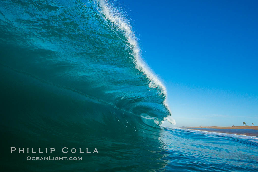 Breaking wave, morning, barrel shaped surf, California