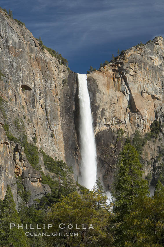 Bridalveil Falls drops 620 through a hanging valley, shown here at peak water flow in spring months from deep snowpack and warm weather melt.  Yosemite Valley. Yosemite National Park, California, USA, natural history stock photograph, photo id 16164
