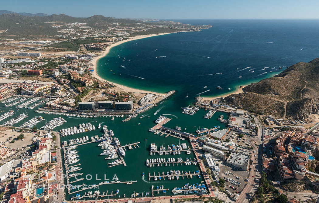 Cabo San Lucas, marina and downtown, showing extensive development and many resorts and sport fishing boats