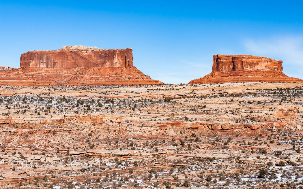 Merrimac Butte (left) and Monitor Butte (right), formed of Entrada sandstone with Carmel and Dewey Bridge formations comprising the basal slope and whiter Navajo sandstone below. Island in the Sky, Canyonlands National Park, Utah, USA, natural history stock photograph, photo id 18096