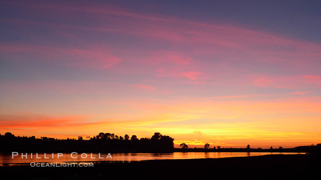 Sunset reflected in the still waters of Batiquitos Lagoon, Carlsbad, California