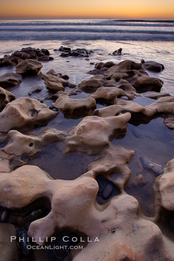 Rocks along the edge of the ocean at sunset. Carlsbad, California, USA, natural history stock photograph, photo id 22195