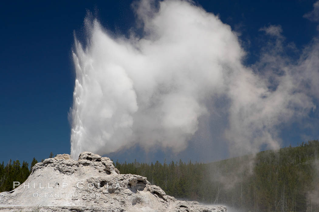 Castle Geyser erupts, reaching 60 to 90 feet in height and lasting 20 minutes. While Castle Geyser has a 12 foot sinter cone that took 5,000 to 15,000 years to form, it is in fact situated atop geyserite terraces that themselves may have taken 200,000 years to form, making it likely the oldest active geyser in the park. Upper Geyser Basin, Yellowstone National Park, Wyoming