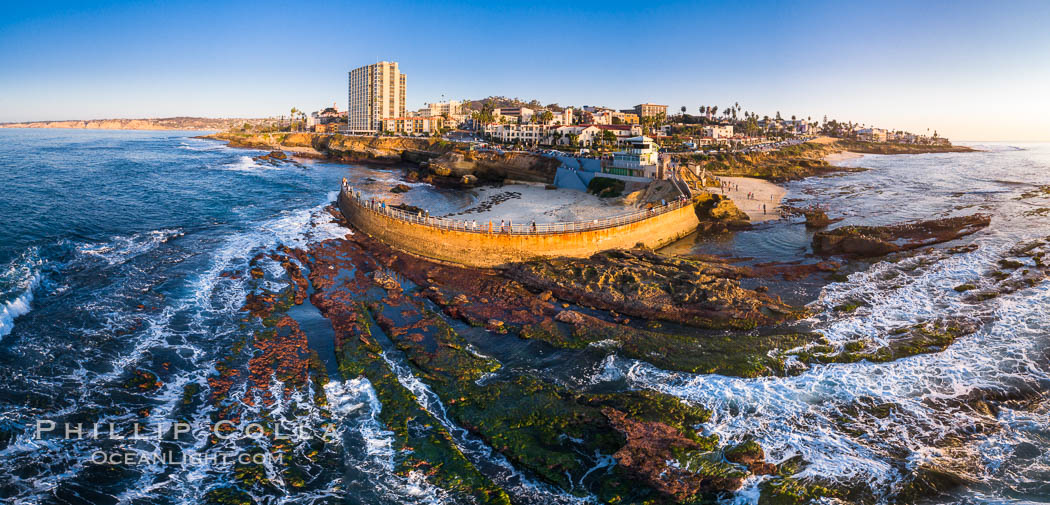 Childrens Pool and La Jolla coastline at sunset, aerial panorama, showing underwater reef exposed at King Low Tide. California, USA, natural history stock photograph, photo id 37977