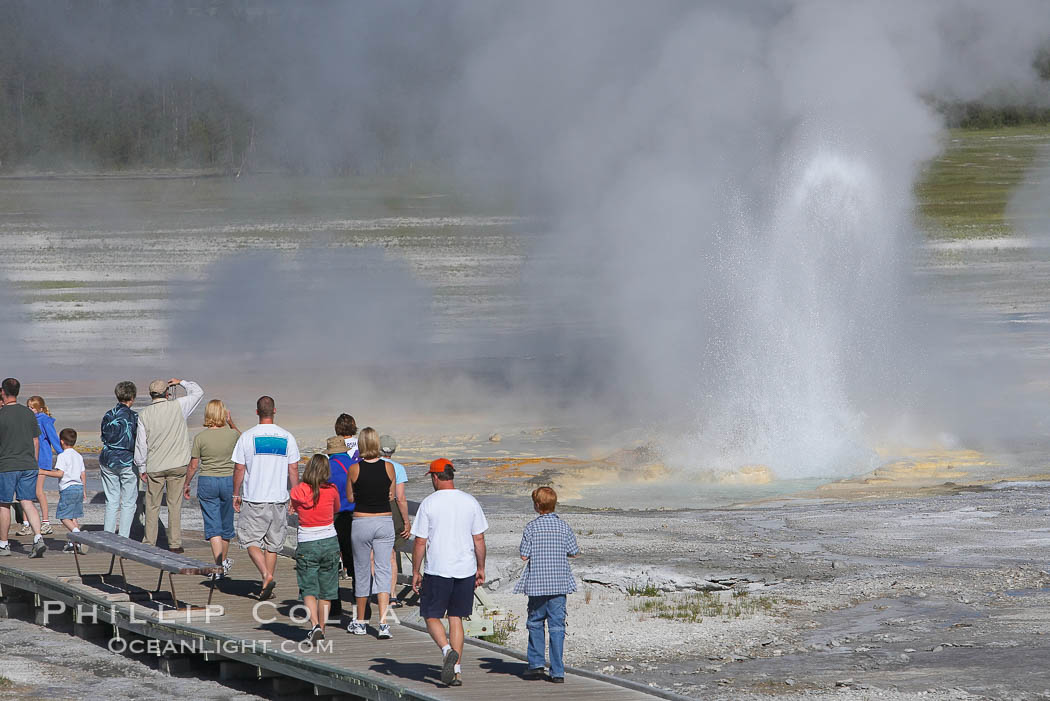 Visitors watch Clepsydra Geyser erupts almost continuously, reaching heights of  feet.  Its name is Greek for water clock, since at one time it erupted very regularly with a three minute interval.  Lower Geyser Basin. Yellowstone National Park, Wyoming, USA, natural history stock photograph, photo id 13535