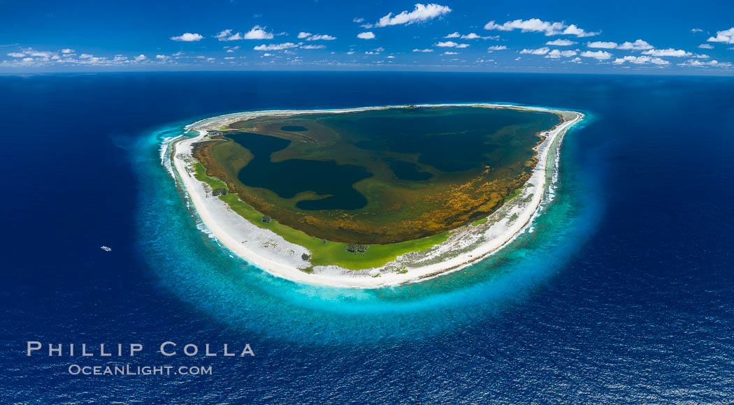 Aerial panorama of Clipperton Island, showing the entire atoll.  Clipperton Island, a minor territory of France also known as Ile de la Passion, is a small (2.3 sq mi) but  spectacular coral atoll in the eastern Pacific. By permit HC / 1485 / CAB (France)., natural history stock photograph, photo id 32929