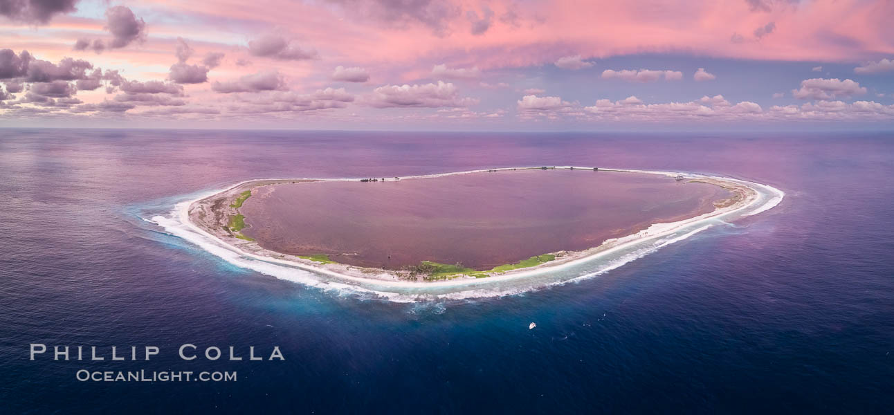 Sunset at Clipperton Island, aerial panoramic photo showing the entire atoll.  Clipperton Island, a minor territory of France also known as Ile de la Passion, is a small (2.3 sq mi) but  spectacular coral atoll in the eastern Pacific. By permit HC / 1485 / CAB (France)., natural history stock photograph, photo id 32895