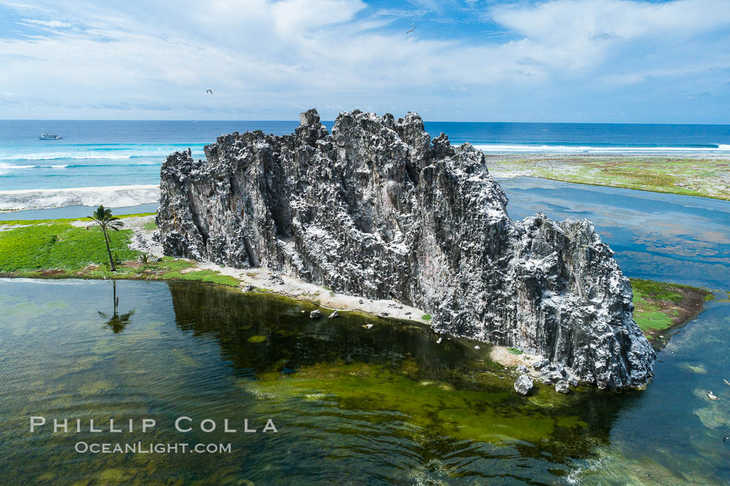 Clipperton Rock, a 95' high volcanic remnant, is the highest point on Clipperton Island, a spectacular coral atoll in the eastern Pacific. By permit HC / 1485 / CAB (France)