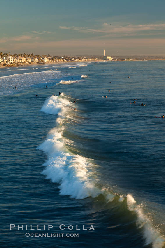 The coast of Oceanside California, waves and surfers, beach houses, just before sunset, winter, looking south. Oceanside Pier, USA, natural history stock photograph, photo id 27600
