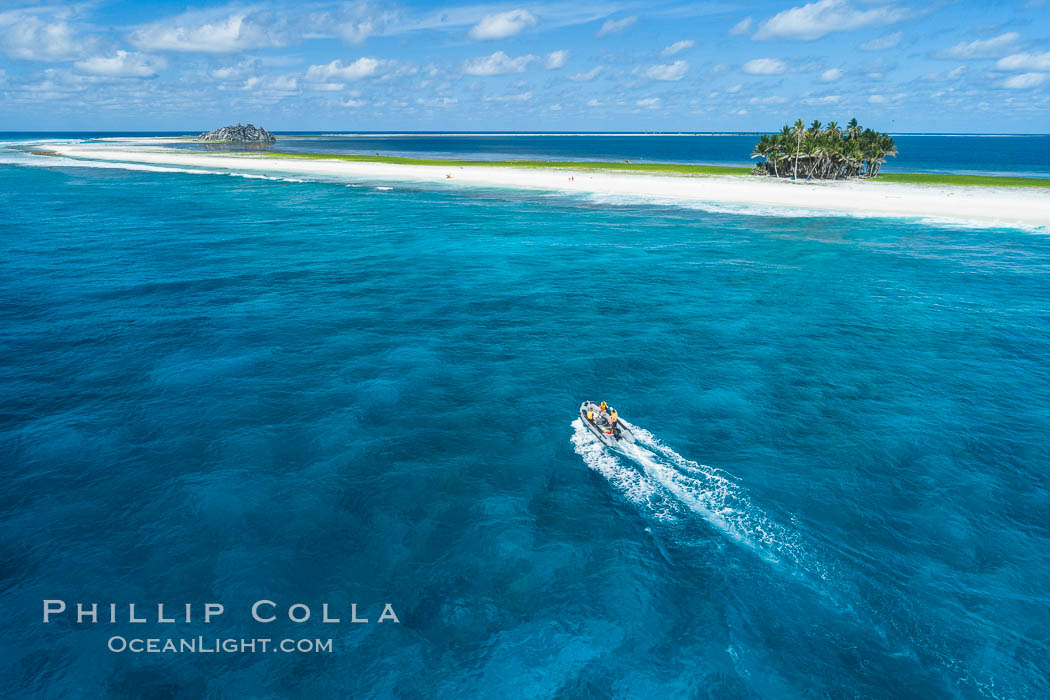 Dive Boat Passes Over Coral Reef at Clipperton Island in the Eastern Tropical Pacific, Aerial Photo. Clipperton has healthy, beatiful coral reefs.  The white beaches are composed of white coralline rubble. Clipperton Island, a minor territory of France also known as Ile de la Passion, is a spectacular coral atoll in the eastern Pacific. By permit HC / 1485 / CAB (France)., natural history stock photograph, photo id 32852