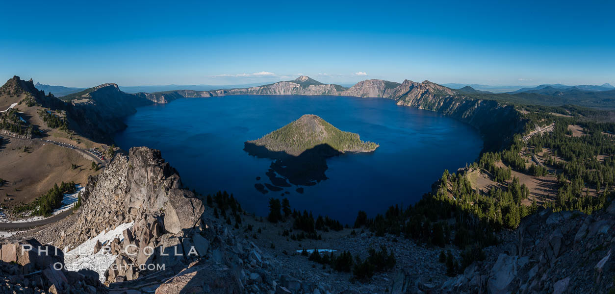 Panorama of Crater Lake from Watchman Lookout Station, panoramic picture. The Watchman Lookout Station No. 168 is one of two fire lookout towers in Crater Lake National Park in southern Oregon. For many years, National Park Service personnel used the lookout to watch for wildfires during the summer months. It is also a popular hiking destination because it offers an excellent view of Crater Lake and the surrounding area. USA, natural history stock photograph, photo id 28632