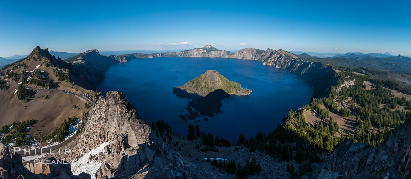 Panorama of Crater Lake from Watchman Lookout Station, panoramic picture. The Watchman Lookout Station No. 168 is one of two fire lookout towers in Crater Lake National Park in southern Oregon. For many years, National Park Service personnel used the lookout to watch for wildfires during the summer months. It is also a popular hiking destination because it offers an excellent view of Crater Lake and the surrounding area. USA, natural history stock photograph, photo id 28633