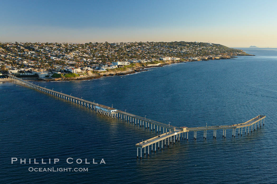 Ocean Beach Pier, also known as the OB Pier or Ocean Beach Municipal Pier, is the longest concrete pier on the West Coast measuring 1971 feet (601 m) long.  Sunset Cliffs and Point Loma extend off to the south, San Diego, California