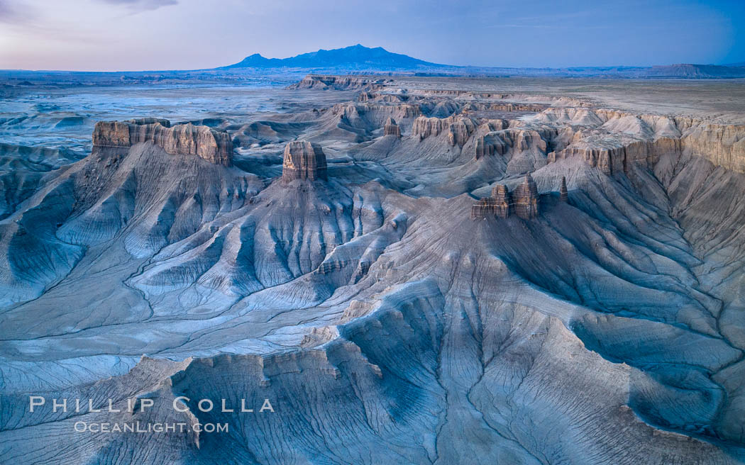 Dawn over the Skyline Rim, Factory Bench and Lower Blue Hills, Utah. The Henry Mountains are in the distance. USA, natural history stock photograph, photo id 38025