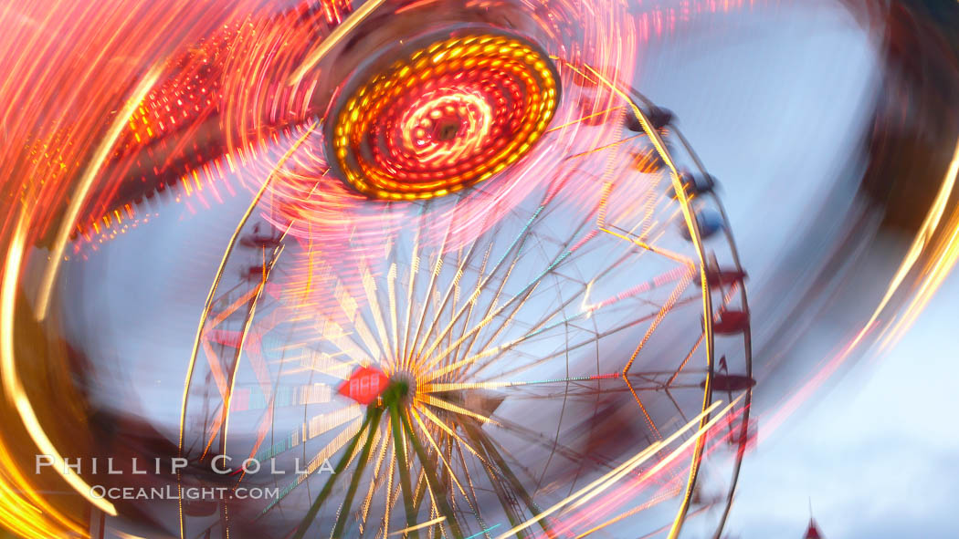 Ferris wheel and fair rides at sunset, blurring due to long exposure. Del Mar Fair, California, USA, natural history stock photograph, photo id 20871