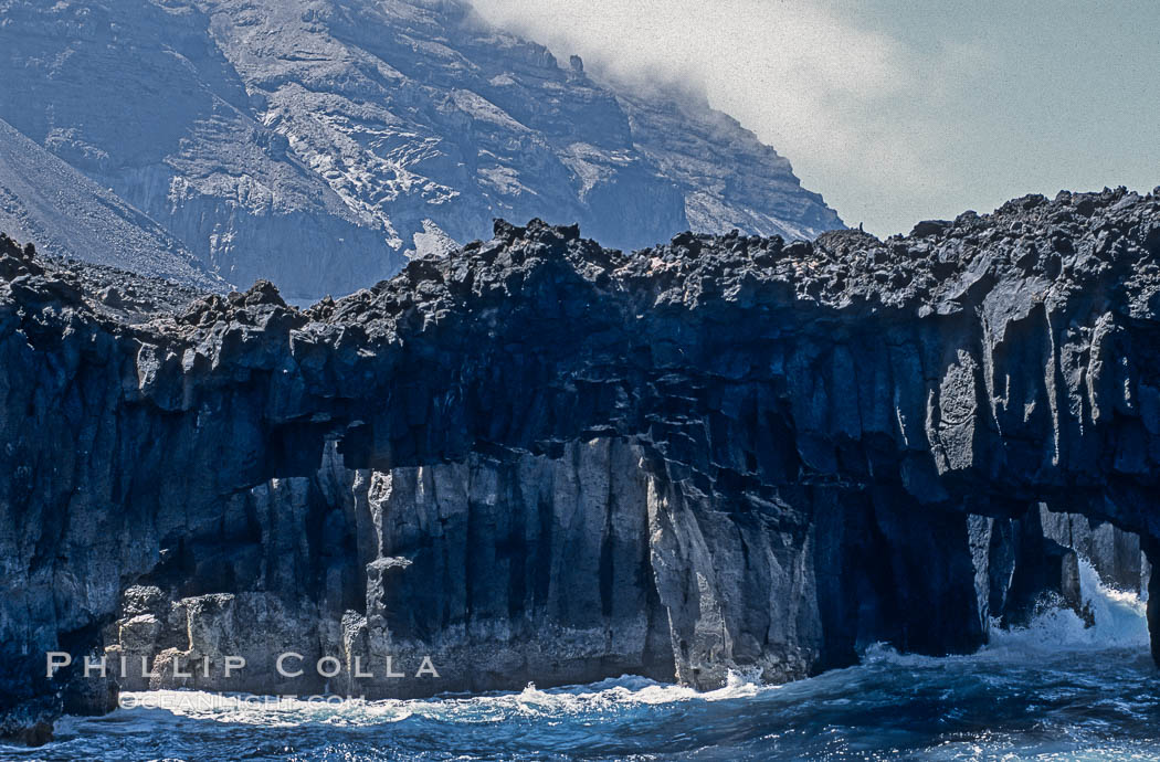 Arcos del Diablo (Devils Arches), a series of enormous volcanic arches that were originally lava tubes.  Some of the arches are exposed above water (seen here) while at least one that we discovered is entirely submarine (El Secreto del Vicki).  Weather side of Guadalupe Island (Isla Guadalupe). Baja California, Mexico, natural history stock photograph, photo id 09763