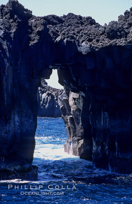 Arcos del Diablo (Devils Arches), a series of enormous volcanic arches that were originally lava tubes.  Some of the arches are exposed above water (seen here) while at least one that we discovered is entirely submarine (El Secreto del Vicki).  Weather side of Guadalupe Island (Isla Guadalupe). Baja California, Mexico, natural history stock photograph, photo id 09767