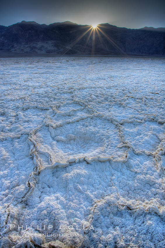 Devils Golf Course. Evaporated salt has formed into gnarled, complex crystalline shapes on the salt pan of Death Valley National Park, one of the largest salt pans in the world.  The shapes are constantly evolving as occasional floods submerge the salt concretions before receding and depositing more salt